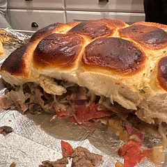 Used red peppers, mushrooms and onions in the mix.  Also pan fried the meat for a minute before putting it on the bread.