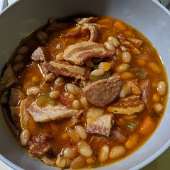 I add andouille sausage, a can of fire roasted diced tomatoes,(undrained) and some dried whole chili peppers. And an extra two cans of chicken broth.