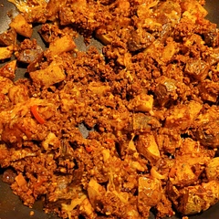 Mixed in soy chorizo from Trader Joe's, a little bit of leftover enchilada sauce and shredded cheese. Quick and easy meal.
