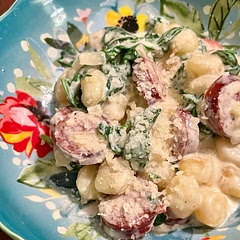 Substituted kielbasa for the chicken sausage, and regular mini gnocchi for the cauliflower one. Added diced onion and minced garlic. And more half and half because I like more of a sauce.