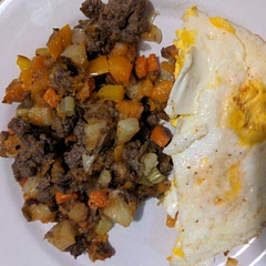 Used beef sausage, half white potatoes and sweet potatoes, added a carrot and a stick of celery along with sweet pepper diced. Generous with the roasted garlic seasoning. Served with fried eggs. Total comfort food.