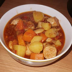 My slow cooker has low, high and keep warm settings (no medium). I followed the recipe, up to around 3/3.5 hours in, when I turned it up to high for around 2 hours (and used scissors to cut the sausages into chunks). I then turned it down to low for 2.5/3 hours. It was in the slow cooker for 8 hours total, and came out absolutely delicious.