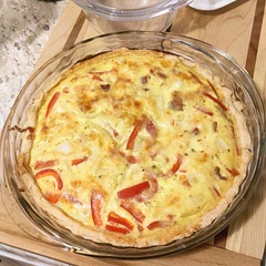 I made it with gouda, cooked bacon, red pepper, and white onions. I added some cayenne and tarragon but that's not quite it. Might just need garlic.
Onions were a bit crunchier than I'd like. I would either precook them or cook the quiche differently (longer and lower?)