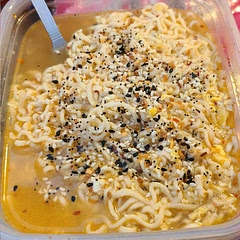 I added the seasoning packet and boiling water to the bowl while the egg was cooking. I also added more red pepper and some black pepper to the egg.