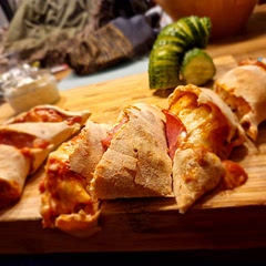 Made with homemade dough and sauce. It worked perfectly with our pizza stone. Can easily feed 4 people! It was so delicious!