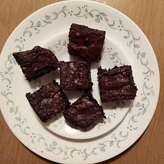 These are so moist and chewy! I added half a cup of semisweet chocolate chips and used half brown sugar. It's hard to tell when they're done, but the middle few inches were still jiggly.