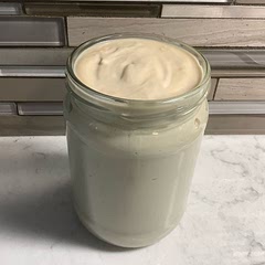 I doubled the recipe for use in my Vitamix.  It made about 2 1/4 cups.  I used unsweetened macadamia milk.  The maple syrup and vanilla make it beige in colour, but still tasty.  It thickens up the fridge.  It is dense and not light and fluffy like regular dairy whipped cream.