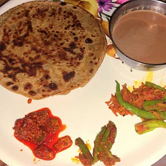 It's crispy, flaky unleavened flatbread.  Very easy to make. one of my favourite breakfasts, served with Chai. ☕ mango and chilli pickles, fried shredded carrots chilli salad.