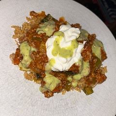 Delicious. Served with Mexican style rice and topped with sour cream and avocado lime crema.