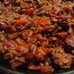 I only had beef kielbasa so I used that. I also doubled the beans and since I didn't have wine, I just used chicken broth. I had to add an additional cup of broth at the end. Doesn't need the tyme. 10/10