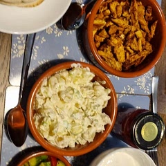 Served with creme fraiche potato salad, cucumber and tomato salad, homemade quick onion pickle and pittas