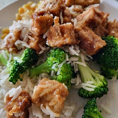 Toss with flour and cornstarch.  Baked at 400 in airfryer for 16 minutes.  Makes sauce and toss tofu in it, in hot pan. Delicious and so easy. 
No tahini so I used one tbs of natural peanut butter and added Sriracha