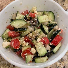 The Greek dressing and vegetable mixture