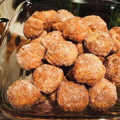 I mean, they taste like what they are-biscuits with cinnamon and sugar. If you added icing, they would be like small canned cinnamon rolls. Easy for kids or teens to do for a quick sweet treat. 
I used a pinch of brown sugar in the mixture and used a baking sheet to get a more even cook around the balls.
With 5 minutes remaining on the timer, I brushed a bit more butter onto the balls and put them back into the oven. 
Once finished, I tossed in sugar and cinnamon.