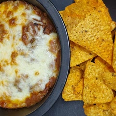 Dead easy to make added extra mixed beans and courgettes. Served with nachos and garlic bread. 