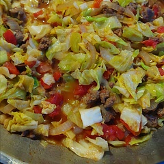 I didn't have peppers so I added mushrooms and switched the beef for turkey sausage. So good! We don't like cabbage but this dish saves it