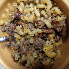 I added a chopped sweet onion to the soup and crumbled bacon on top. I also used beef broth instead of chicken. It tasted like a bacon cheeseburger. I added a little Italian spice as well.