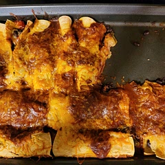 Picture looks burnt due to lighting and the dark enchilada sauce. I made the homemade sauce referenced in the recipe and it was on point! I will make this a staple for sure