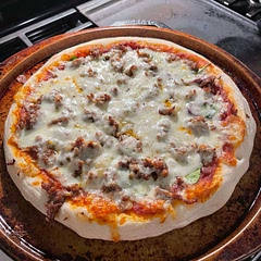 Super good pizza crust. Only thing I would change next time is baking it longer without the cheese on top to crisp it up more.