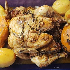 I decided to add  pink sea salt and sazon con achiote to the seasonings to give it more flavor and fresh thyme on top too. I also sub the aluminum balls with potatoes and yams to elevate the chicken and let them soak up all the yummy juices.  