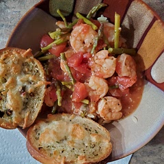 Very tasty! I used 2 cans of diced tomatoes, so became saucy like cioppino. I substituted the angel hair pasta for Orzo that I had on hand.