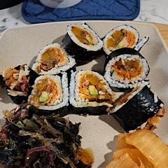 Added grated carrots, radish and slices of lobster mushrooms. 
Served with seaweed salad. 