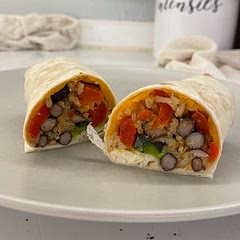 Added cooked white rice to bulk it up a bit. I bet it would be 10x better if I fried the finished burritos in a little bit of butter to get the tortilla all crispy.