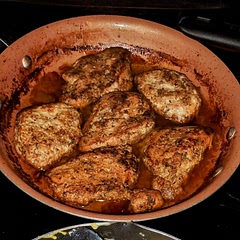 Okay for starters we only did the chicken part and I didn't have Rosemary on hand so we used Marjoram instead we took all the ingredients and mix them together everything except for the butter and let the chicken marinate in it for 30 minutes afterwards we put olive oil in the frying pan and fried each side a few minutes to give it that nice char and then cut up one stick of salted butter and one stick of margarine and put it all over the top of the chicken and then placed it in the oven to finish cooking and I have to say it turned out absolutely amazing