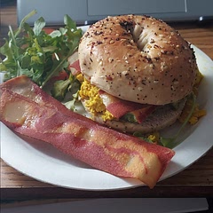 everything bagel, scrambled tofu (i used a recipe on the app), avocado tomato, arugula, and morning star bacon. I've made this a couple times already and it's so good.