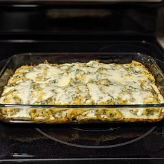 This was delicious! Possibly the most delicious recipe I have ever tried. I'll definitely make this again, but next time I'll do some prep work (i.e. cooking the chicken, and chopping it up; shredding the cheese) before hand to make prep easier.