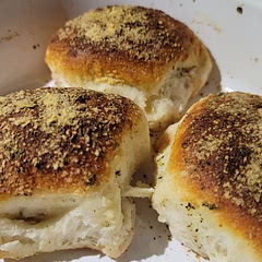 Used jumbo biscuits and it really helped make the rolling easier.
I probably packed them too tight in the casserole dish, will separate each ball in the future.
When flattening out use both hands, don't put down on the cutting board, or it sticks.