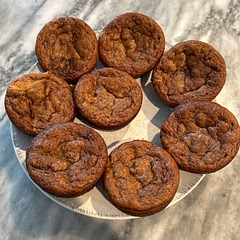 I got 11 large muffins after doubling the recipe.  I also baked them for 12 minutes. They were good. I would probably use more spices next time. My kids added powdered sugar to theirs 🫤