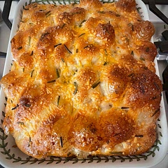 Beautiful! Due to a timing issue, I accidentally had to leave the dough resting in the fridge for 5 days, but it came out perfect anyway. I topped mine with rosemary, shredded cheddar, and sea salt.