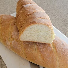 I put a cast iron pan in the bottom of the oven as it was heating up and put a cup of ice cubes in the pan right before I added the bread. It baked almost 30 minutes.  Delicious,  crispy crust and light and fluffy inside 