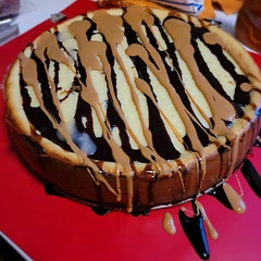 Added some caramel. Definitely not as rich as I was expecting, which is a plus for us! Might try a different cheesecake recipe for adding on top of the brownie. Overall it was a great sucess!