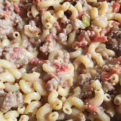 I used Rotel tomatoes with green chiles.  Kicked it up a notch. I also doubled the cheese and added about 2tbls of milk when stirring in the cheese.