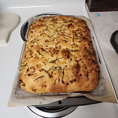 The bread turned out fantastic. Unfortunately, the garlic and rosemary I put on top didn't want to stay there, so it mostly fell off. My boyfriend and I made this together and it was a super fun date night! We actually ran out of salt and used some garlic salt instead, and I feel like just that tiny bit of garlic salt added an extra oomph. But, then again, I am a garlic addict ;)