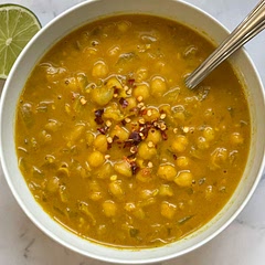 MAKE THIS NOW! So easy and fast, with ingredients you almost always have on hand. Have made numerous times, and in husband’s “top 3 soups ever” list.

Recipe is best as is, with the two cans of coconut milk. However, I sometimes reduce calories by using one can and 3 cups broth. 

I also omit the maple syrup and add more lime and red pepper flakes.

Makes about 3 bowls, so double if more people.