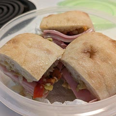 Made individual small muffalettas using the small Italian ciabatta rolls and, because I was in a hurry, store-bought olive salad. 2 slices of each meat & 1 slice of each cheese.