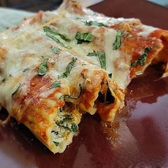 This was so delicious and super easy to make. I added some ground turkey meat and Italian sausage, with some fresh Basil sprinkled over the top. My family practically licked the pan clean.