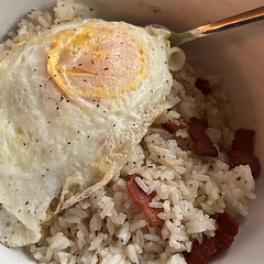 I fried up some bacon pieces first and set them aside and then fried the rice in the bacon grease. I mixed the bacon back into the rice instead of serving on the side. It was so delicious!