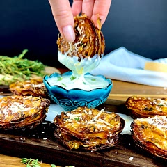 Note: This recipe yields rustic Parmesan potato pucks that are crispy on the outside and tender on the inside. Enjoy the delightful combination of Parmesan cheese, thyme, and perfectly layered potatoes.
