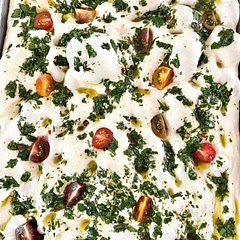 Favorite focaccia recipe and so easy to make! Used a full size sheet pan to get a thinner bread.