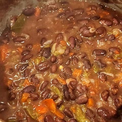 I used canned beans, and skipped the vinegar, sugar, wine, and spicy peppers. Turned out really well but ended up using too much cumin.
I also threw in a bay leaf. 
