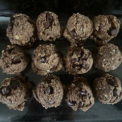 Added 1 tbsp wheat germ, 1 tbsp flaxseed meal, 1  scoop of MM chocolate protein powder, and c.c chips. Forgot to flatten and still turned out yummy. Made 24 mini balls. Next time use mini c.c chips.