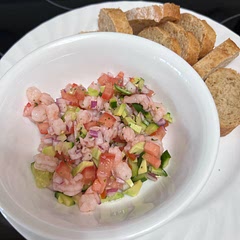 I’m having it with baguette and tostito chips. It is better with the chips but it really doesn’t matter what you have it with. It’s so fresh and delicious, I could literally use a spoon :)
