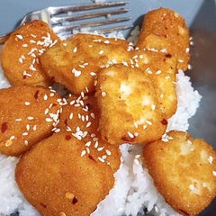 I always skip a step and use chicken nuggets, bake them, pull them out to cover them in the sauce, and then let them sit in the oven a little while longer.  I wish I had known this in college, it's delicious and simple.
