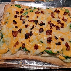 I changed some things up. I used pizza dough instead of Cresent rolls. I added spinach and left off the tomato.