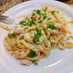 This was a great meal! I would rate it a 9 out of 10.  I can't believe it is so easy to make great tasting alfredo. I used 16 oz of fettuccine and 3 large cloves of garlic. I followed what someone else suggested and pre-cooked the fettuccine most of the way in water and then added it when the recipe called for it. We also added a half stick of butter as someone else suggested.  I cooked the chicken with my fav chicken seasoning "McCormick Perfect Pinch Rotisserie Chicken Seasoning". I used the left overs for lunch the next day - just added some milk and heated it up so it would be saucy again.