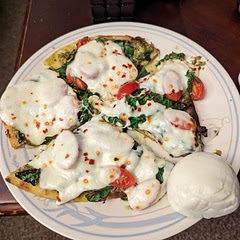 Added tomatoes and put the cheese on top